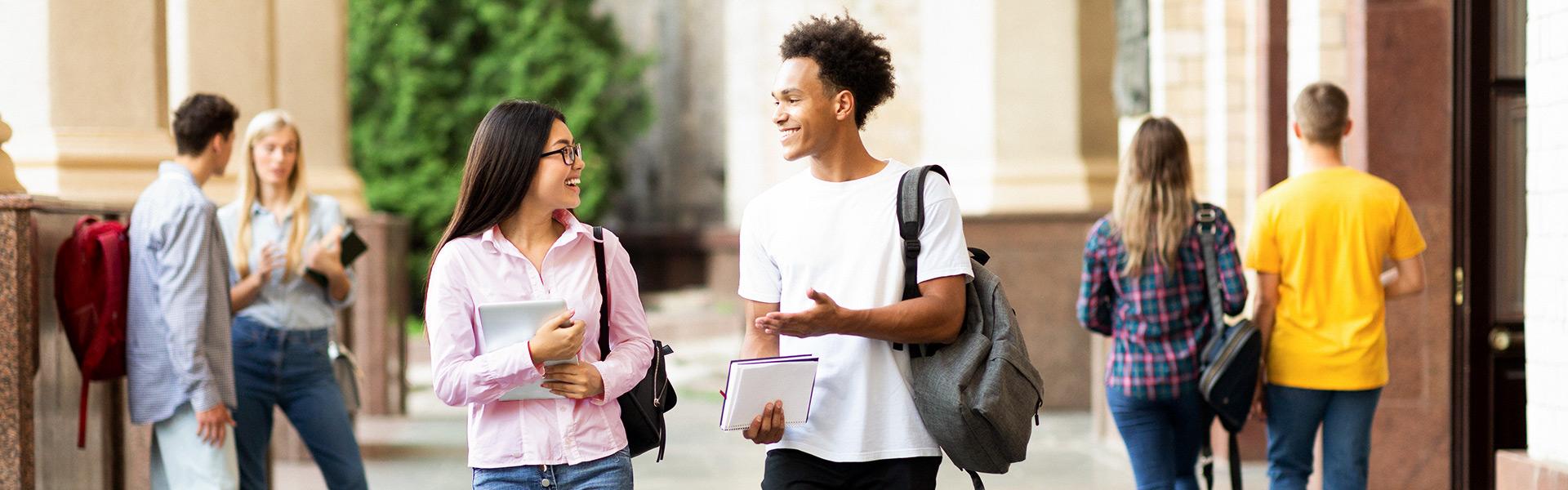 group of students walking on a college campus